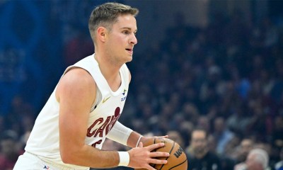 Cavaliers guard Sam Merrill (5) dribbles the ball in the first quarter against the Toronto Raptors at Rocket Arena with the Bulls logo in the background