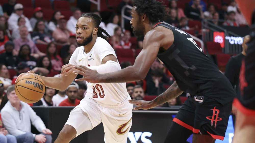 Cleveland Cavaliers guard Darius Garland (10) dribbles the ball as Houston Rockets forward Tari Eason (17) defends during the first quarter at Toyota Center.