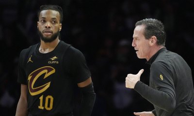 Cavaliers head coach Kenny Atkinson directs guard Darius Garland (10) and the team as they play the Minnesota Timberwolves in the fourth quarter at Target Center with Lou Williams in the background
