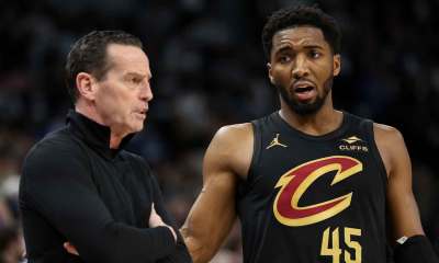 Cleveland Cavaliers guard Donovan Mitchell (45) talks with head coach Kenny Atkinson during the second quarter against the Minnesota Timberwolves at Target Center.
