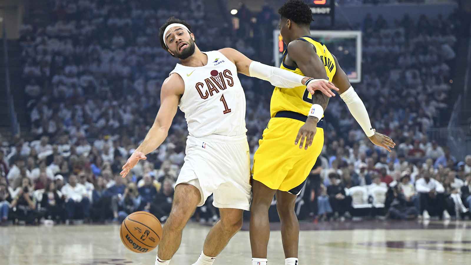 Indiana Pacers guard Bennedict Mathurin (00) defends Cleveland Cavaliers guard Max Strus (1) in the first quarter during game two of the second round of the 2025 NBA Playoffs at Rocket Arena.