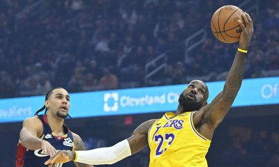 Los Angeles Lakers forward LeBron James (23) catches a pass beside Cleveland Cavaliers guard Jaylon Tyson (20) in the first quarter at Rocket Arena.
