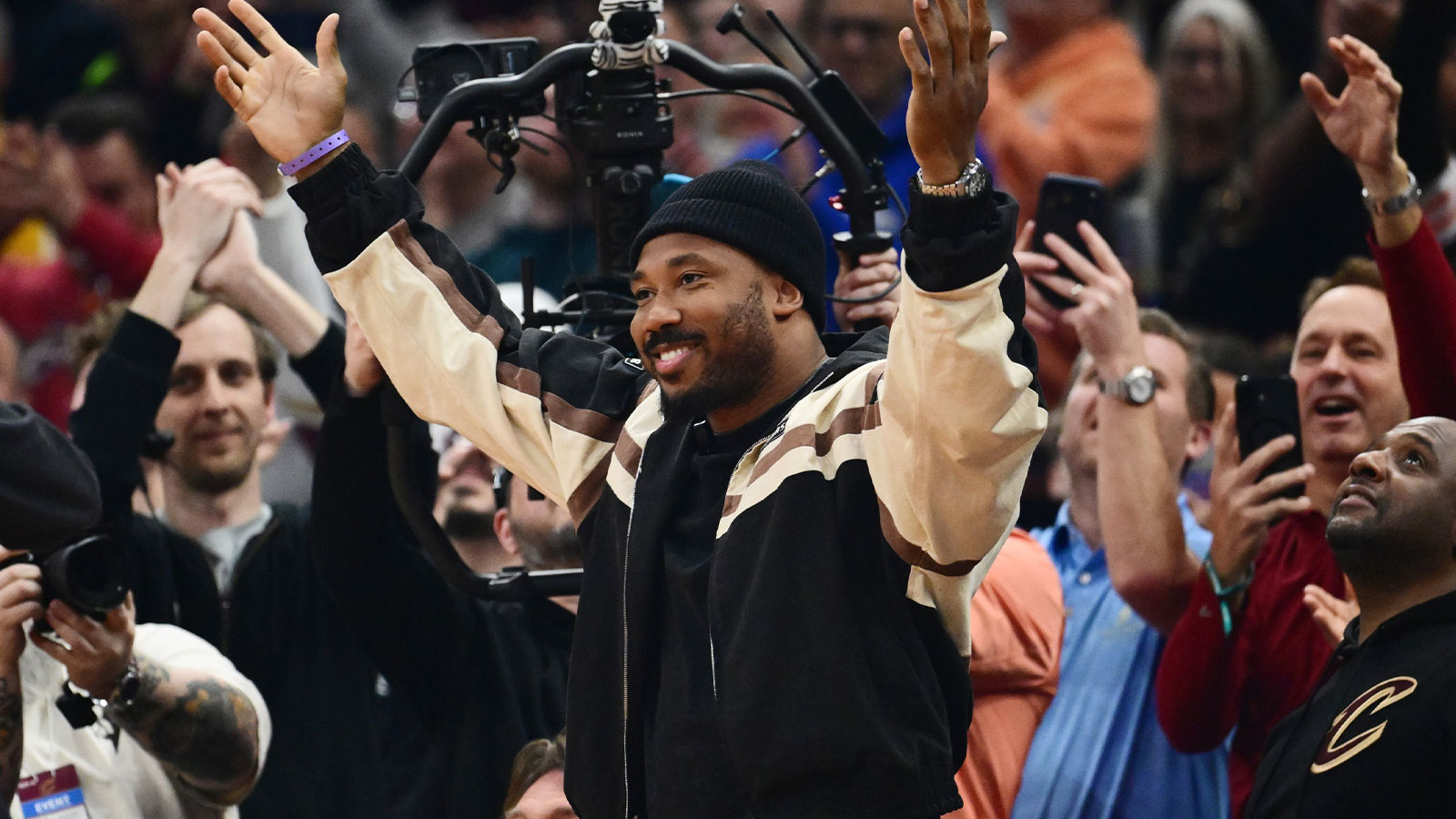 Browns player Myles Garrett acknowledges the crowd during the first half of the game between the Cleveland Cavaliers and the New York Knicks at Rocket Arena