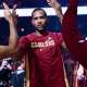 Cavs center Evan Mobley (4) is introduced before the game between the Cavaliers and the Sacramento Kings at Rocket Arena with Cavs' James Harden in the background