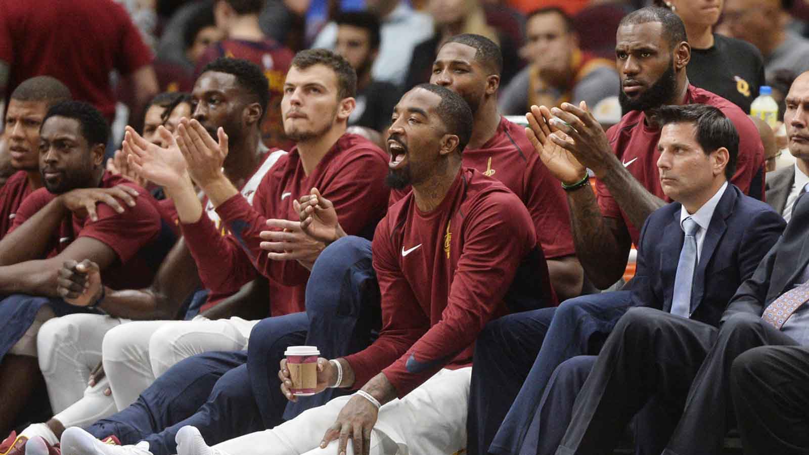 Cavaliers guard JR Smith (5) and forward LeBron James (23) and guard Kyrie Irving (2) watch from the bench during the fourth quarter against the Washington Wizards at Quicken Loans Arena. The Wizards won 127-115