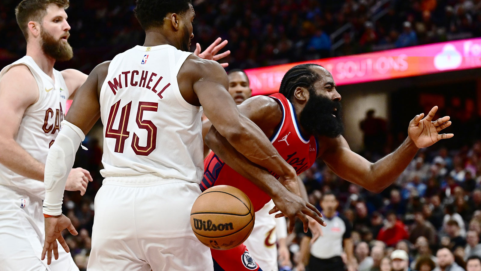 Cleveland Cavaliers guard Donovan Mitchell (45) fouls Los Angeles Clippers guard James Harden (1) during the second half at Rocket Arena.