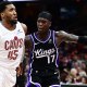 Cleveland Cavaliers guard Donovan Mitchell (45) drives to the basket against Sacramento Kings guard Dennis Schroder (17) during the second half at Rocket Arena.