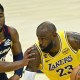 Cleveland Cavaliers guard Donovan Mitchell (45) defends Los Angeles Lakers forward LeBron James (23) in the fourth quarter at Rocket Arena.