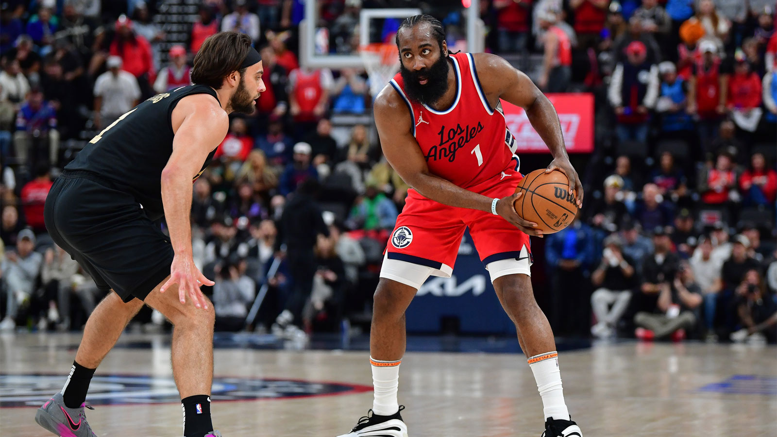 Los Angeles Clippers guard James Harden (1) controls the ball against Cleveland Cavaliers guard Max Strus (1) during the second half at Intuit Dome.