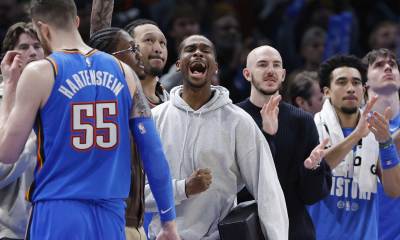 Thunder guard Shai Gilgeous-Alexander (2) screams as he watches his team play against the Cleveland Cavaliers during the second half at Paycom Center with Jalen Williams