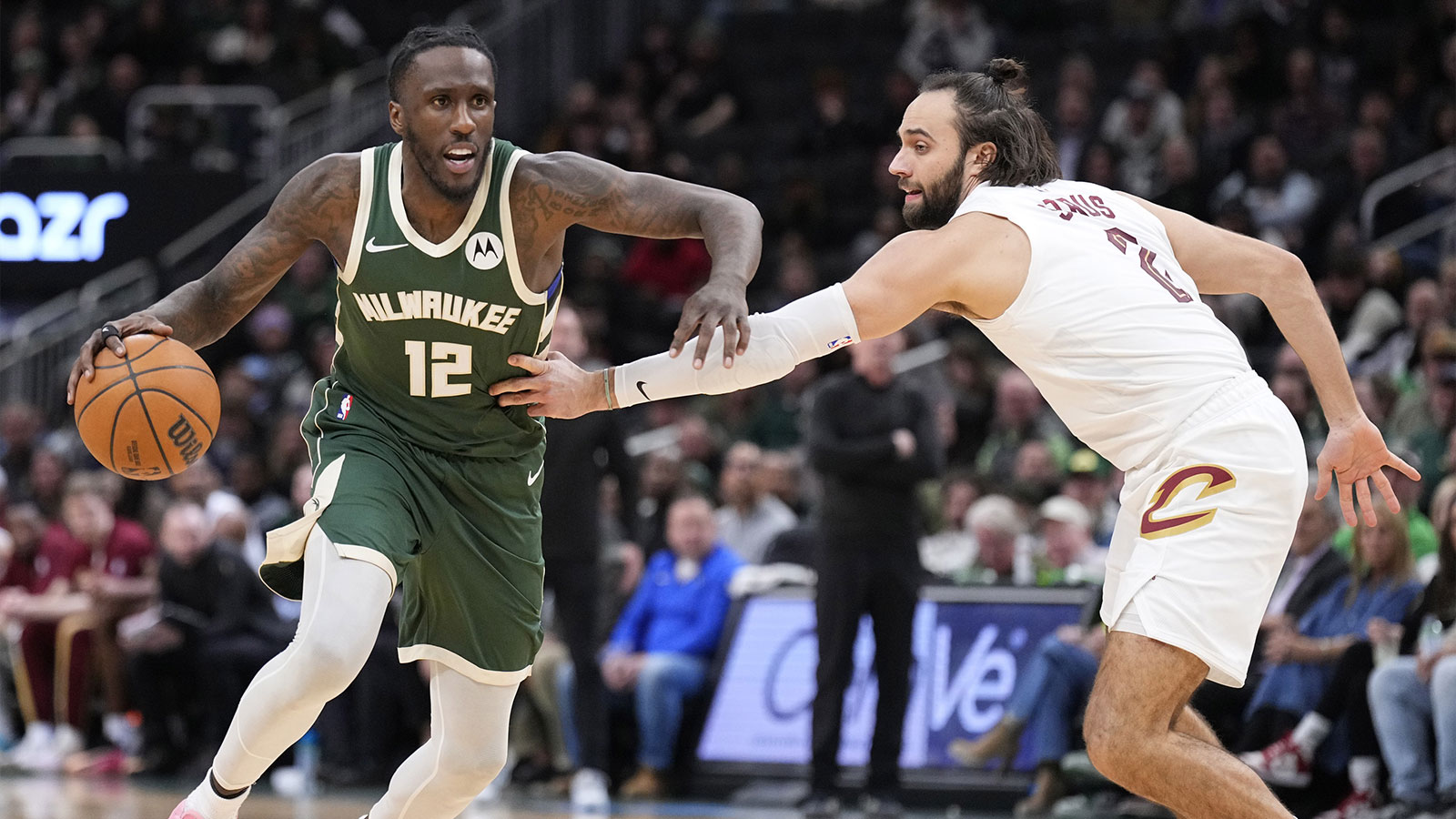 Cavaliers guard/forward Max Strus (2) in the second half at Fiserv Forum with Cavs head coach Kenny Atkinson in the background