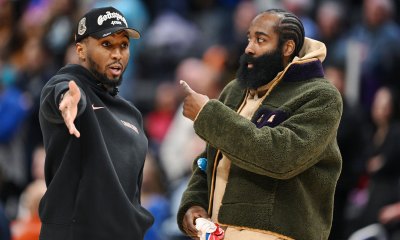 Cleveland Cavaliers guard Donovan Mitchell (left) talks with teammate James Harden during a timeout against the Detroit Pistons in the second half at Little Caesars Arena. Neither played in their overtime loss to the Pistons