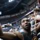 Cleveland Cavaliers guard Donovan Mitchell (45), whose left eye was bruised in a practice, high fives fans after a game against the New Orleans Pelicans at Smoothie King Center.