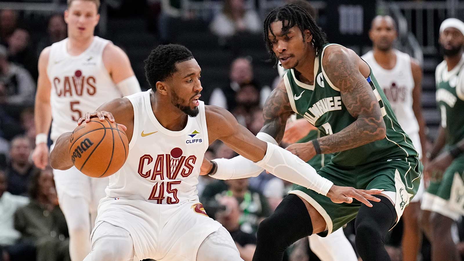 Cleveland Cavaliers guard Donovan Mitchell (45) drives against Milwaukee Bucks guard/forward Kevin Porter Jr. (7) in the second half at Fiserv Forum