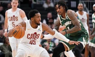Cleveland Cavaliers guard Donovan Mitchell (45) drives against Milwaukee Bucks guard/forward Kevin Porter Jr. (7) in the second half at Fiserv Forum