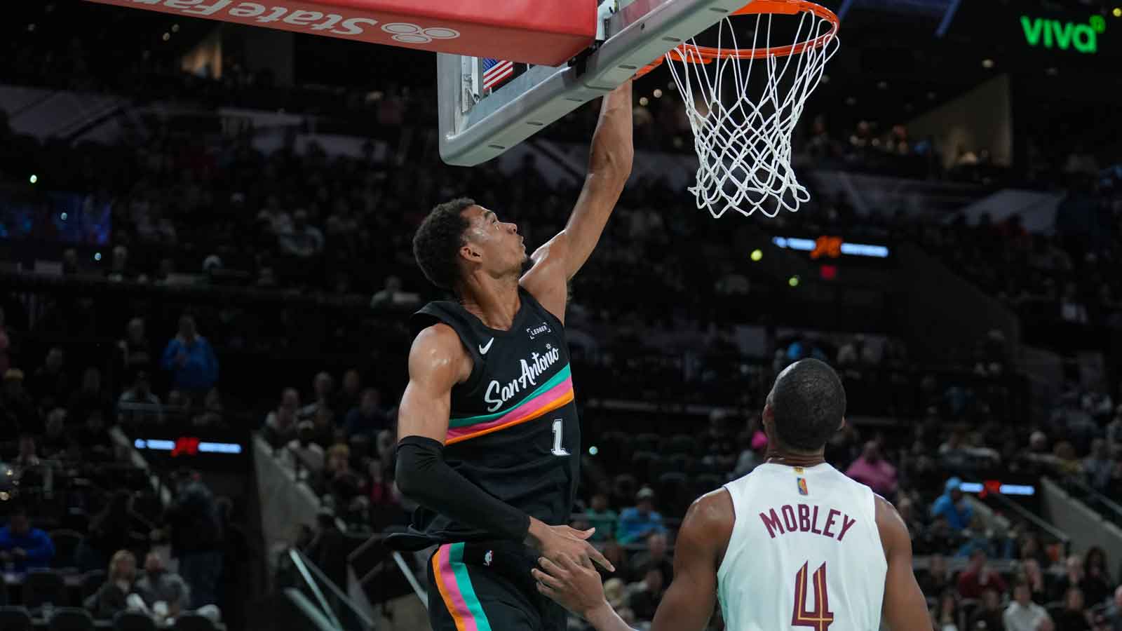 San Antonio Spurs forward Victor Wembanyama (1) shoots in front of Cleveland Cavaliers center Evan Mobley (4) in the second half at Frost Bank Center.