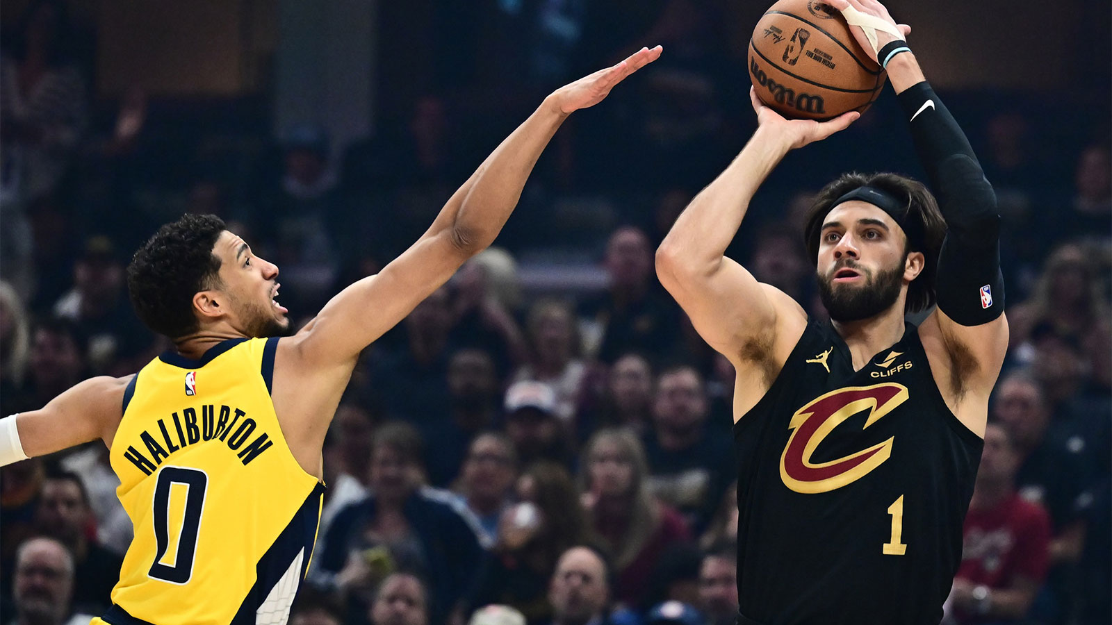 Cleveland Cavaliers guard Max Strus (1) shoots over the defense of Indiana Pacers guard Tyrese Haliburton (0) during the first quarter of game five of the second round for the 2025 NBA Playoffs at Rocket Arena.