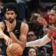 Cleveland Cavaliers center Jarrett Allen (31) passes the ball as Toronto Raptors forward Collin Murray-Boyles (12) defends during game four of the first round of the 2026 NBA Playoffs at Scotiabank Arena.
