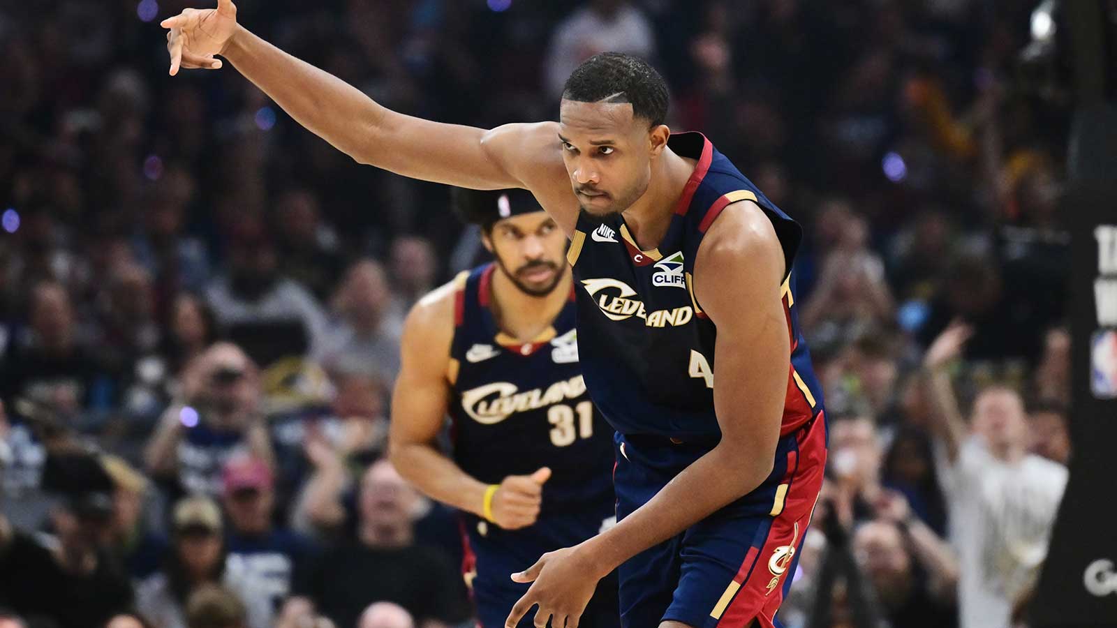 Cavaliers center Evan Mobley (4) celebrates after hitting a three point basket against the Toronto Raptors during the second half of game one in the first round of the 2026 NBA Playoffs at Rocket Arena
