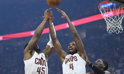 Cavs guard Donovan Mitchell (45) and center Evan Mobley (4) reach for the ball beside Atlanta Hawks forward Onyeka Okongwu (17) in the first quarter at Rocket Arena