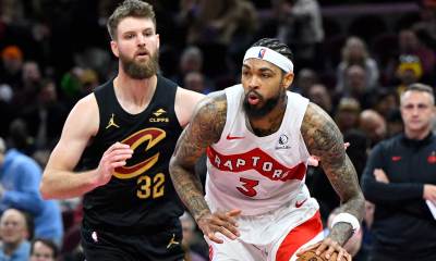Raptors forward Brandon Ingram (3) dribbles beside Cleveland Cavaliers forward Dean Wade (32) in the third quarter at Rocket Arena