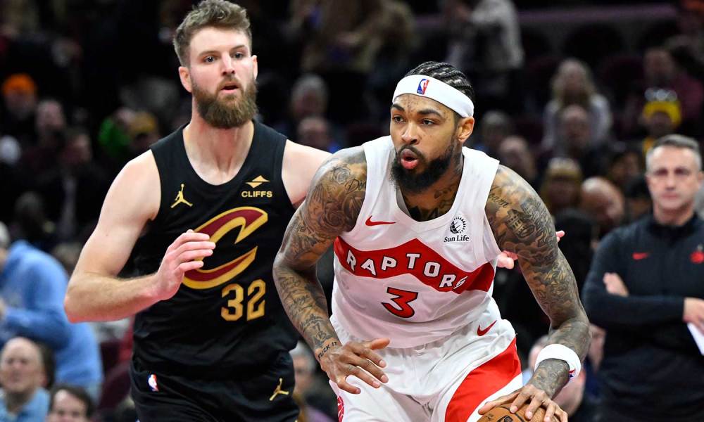 Raptors forward Brandon Ingram (3) dribbles beside Cleveland Cavaliers forward Dean Wade (32) in the third quarter at Rocket Arena