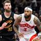 Raptors forward Brandon Ingram (3) dribbles beside Cleveland Cavaliers forward Dean Wade (32) in the third quarter at Rocket Arena