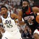 Rockets guard James Harden (13) drives to the hoop against Utah Jazz guard Donovan Mitchell (45) in the fourth quarter in game four of the first round of the 2019 NBA Playoffs at Vivint Smart Home Arena with Cavs logo in the background
