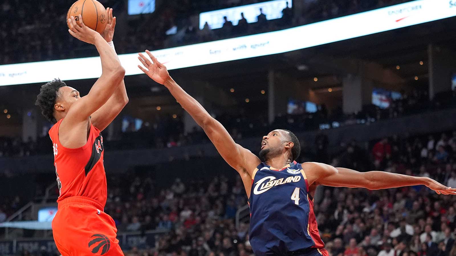 Cleveland Cavaliers forward Evan Mobley (4) defends against Toronto Raptors guard Scottie Barnes (4) during the first half at Scotiabank Arena. 