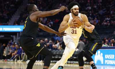 Cleveland Cavaliers center Jarrett Allen (31) drives in between Golden State Warriors forward Draymond Green (23) and forward Gui Santos (15) during the third quarter at Chase Center.