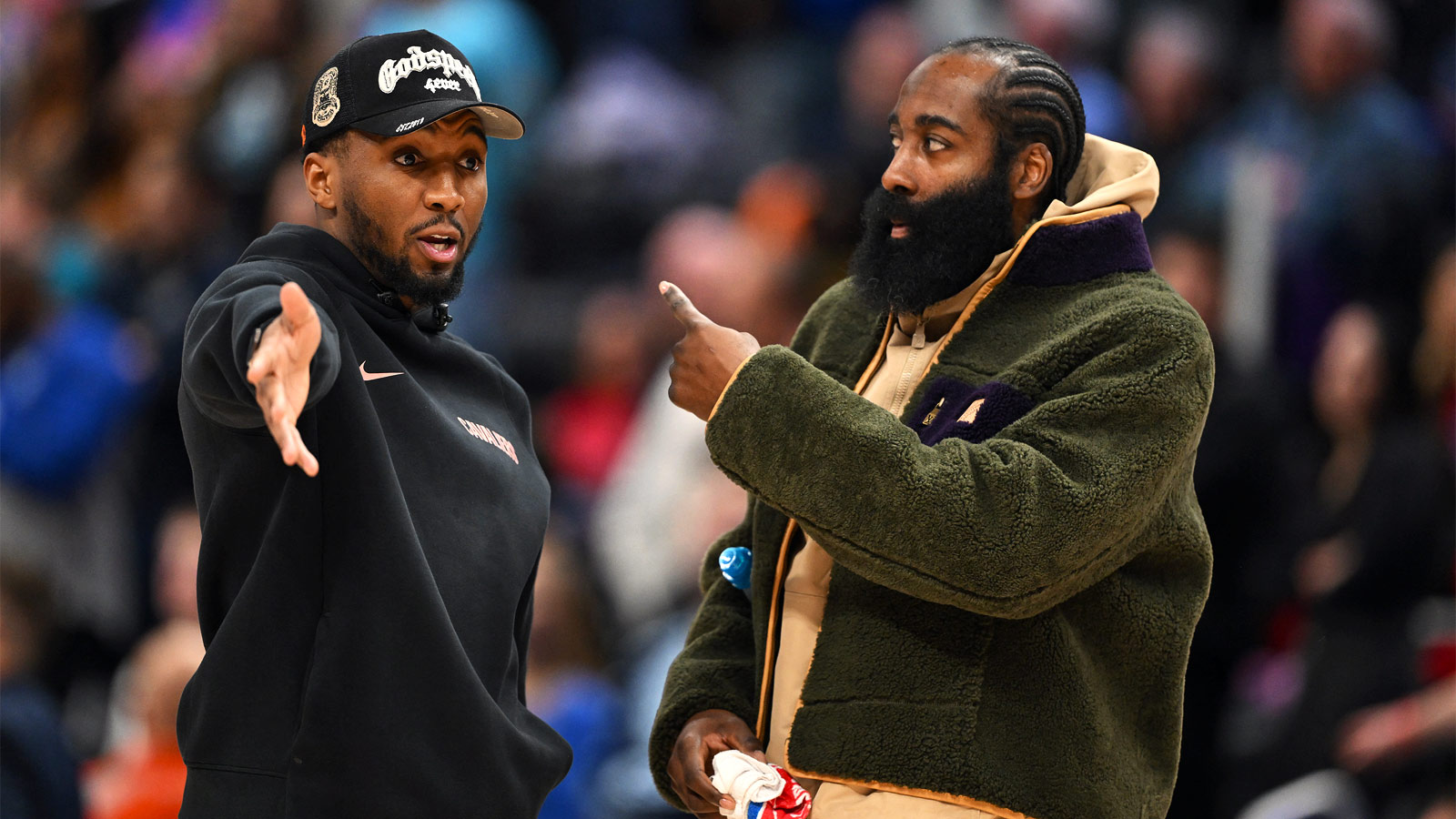Cleveland Cavaliers guard Donovan Mitchell (left) talks with teammate James Harden during a timeout against the Detroit Pistons in the second half at Little Caesars Arena.Neither played in their overtime loss to the Pistons.