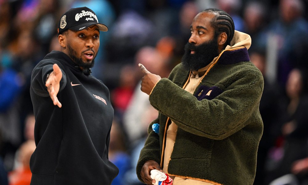 Cleveland Cavs guard Donovan Mitchell (left) talks with teammate James Harden during a timeout against the Detroit Pistons in the second half at Little Caesars Arena.Neither played in their overtime loss to the Pistons. Cavs 2026-27 overseas Cavs training camp