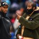 Cleveland Cavaliers guard Donovan Mitchell (left) talks with teammate James Harden during a timeout against the Detroit Pistons in the second half at Little Caesars Arena.Neither played in their overtime loss to the Pistons.