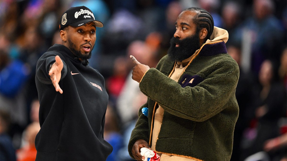 Cleveland Cavaliers guard Donovan Mitchell (left) talks with teammate James Harden during a timeout against the Detroit Pistons in the second half at Little Caesars Arena.Neither played in their overtime loss to the Pistons.