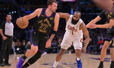 Los Angeles Lakers guard Luka Doncic (77) is defended by Cleveland Cavaliers guard James Harden (1) as he drives to the basket in the first half at Crypto.com Arena.