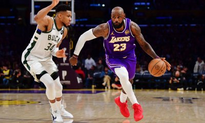 Los Angeles Lakers forward LeBron James (23) moves the ball against Milwaukee Bucks forward Giannis Antetokounmpo (34) during the second half at Crypto.com Arena.