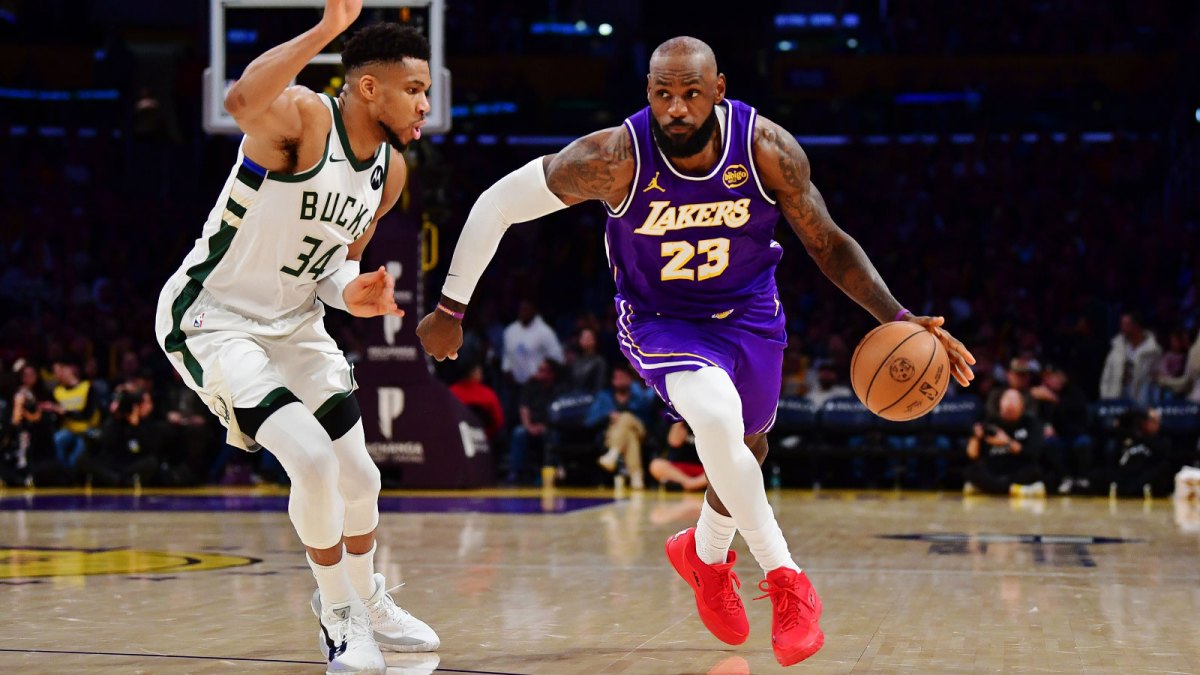 Los Angeles Lakers forward LeBron James (23) moves the ball against Milwaukee Bucks forward Giannis Antetokounmpo (34) during the second half at Crypto.com Arena.