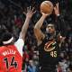 Cleveland Cavaliers guard Donovan Mitchell (45) shoots the ball against Toronto Raptors guard Ja'Kobe Walter (14) during game four of the first round of the 2026 NBA Playoffs at Scotiabank Arena.