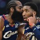 Cavs guard Donovan Mitchell (45) talks with guard James Harden