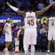Cavaliers guard Donovan Mitchell (45) celebrates in overtime against the Detroit Pistons during game five of the second round of the 2026 NBA Playoffs at Little Caesars Arena with ESPN's Brian Windhorst in the background