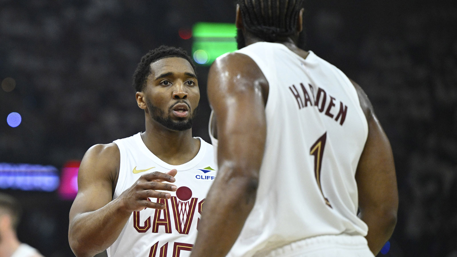 Cavaliers guard Donovan Mitchell (45) talks to guard James Harden (1) against the Toronto Raptors in the first quarter of game five of the first round of the 2026 NBA Playoffs at Rocket Arena