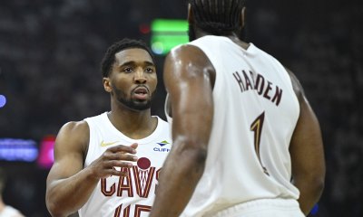 Cavaliers guard Donovan Mitchell (45) talks to guard James Harden (1) against the Toronto Raptors in the first quarter of game five of the first round of the 2026 NBA Playoffs at Rocket Arena