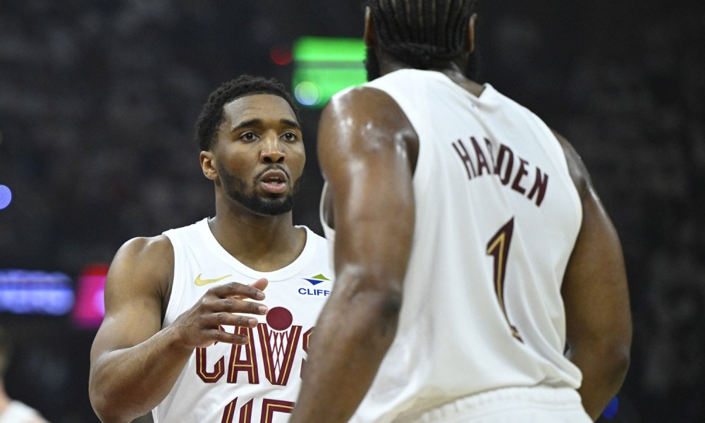 Cavaliers guard Donovan Mitchell (45) talks to guard James Harden (1) against the Toronto Raptors in the first quarter of game five of the first round of the 2026 NBA Playoffs at Rocket Arena