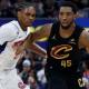 Cavs' Donovan Mitchell dribbles against Pistons' Ausar Thompson