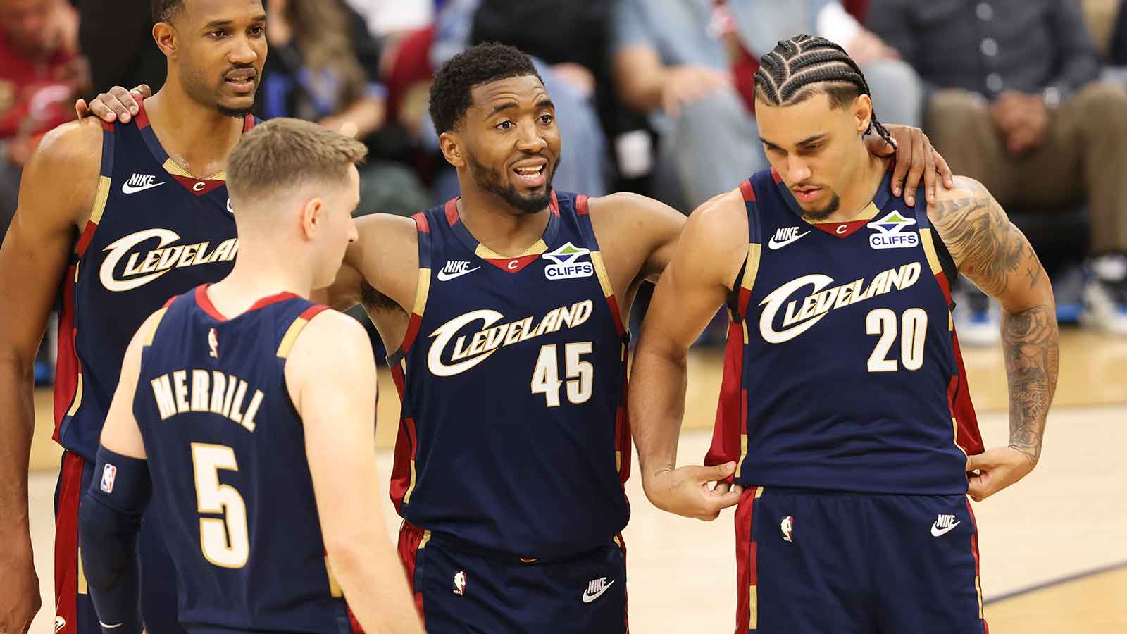 Cavaliers guard Donovan Mitchell (45) huddles around teammates during the fourth quarter against the New York Knicks during game three of the eastern conference finals for the 2026 NBA playoffs at Rocket Arena