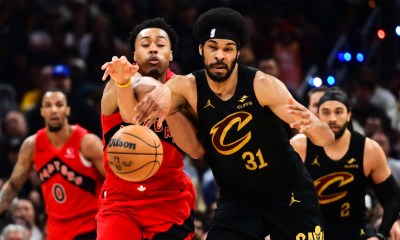 Toronto Raptors forward Scottie Barnes (4) goes for a loose ball against Cleveland Cavaliers center Jarrett Allen (31) during the second half of game seven in the first round of the 2026 NBA Playoffs at Rocket Arena.