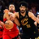 Toronto Raptors forward Scottie Barnes (4) goes for a loose ball against Cleveland Cavaliers center Jarrett Allen (31) during the second half of game seven in the first round of the 2026 NBA Playoffs at Rocket Arena.