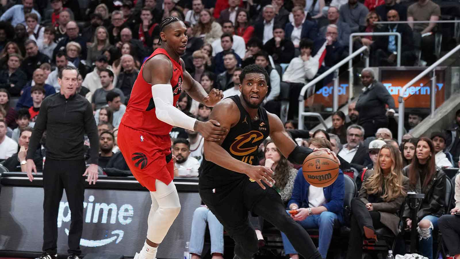 Cavs guard Donovan Mitchell (45) controls the ball