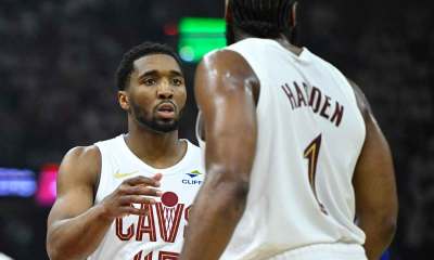 Cavs guard Donovan Mitchell (45) talks to guard James Harden