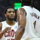 Cavs guard Donovan Mitchell (45) talks to guard James Harden